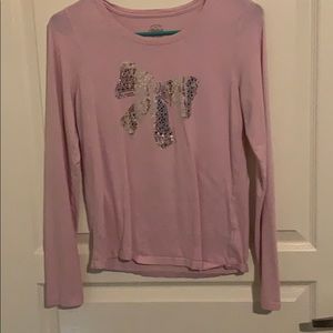 Pinkish purple long sleeve tee shirt.